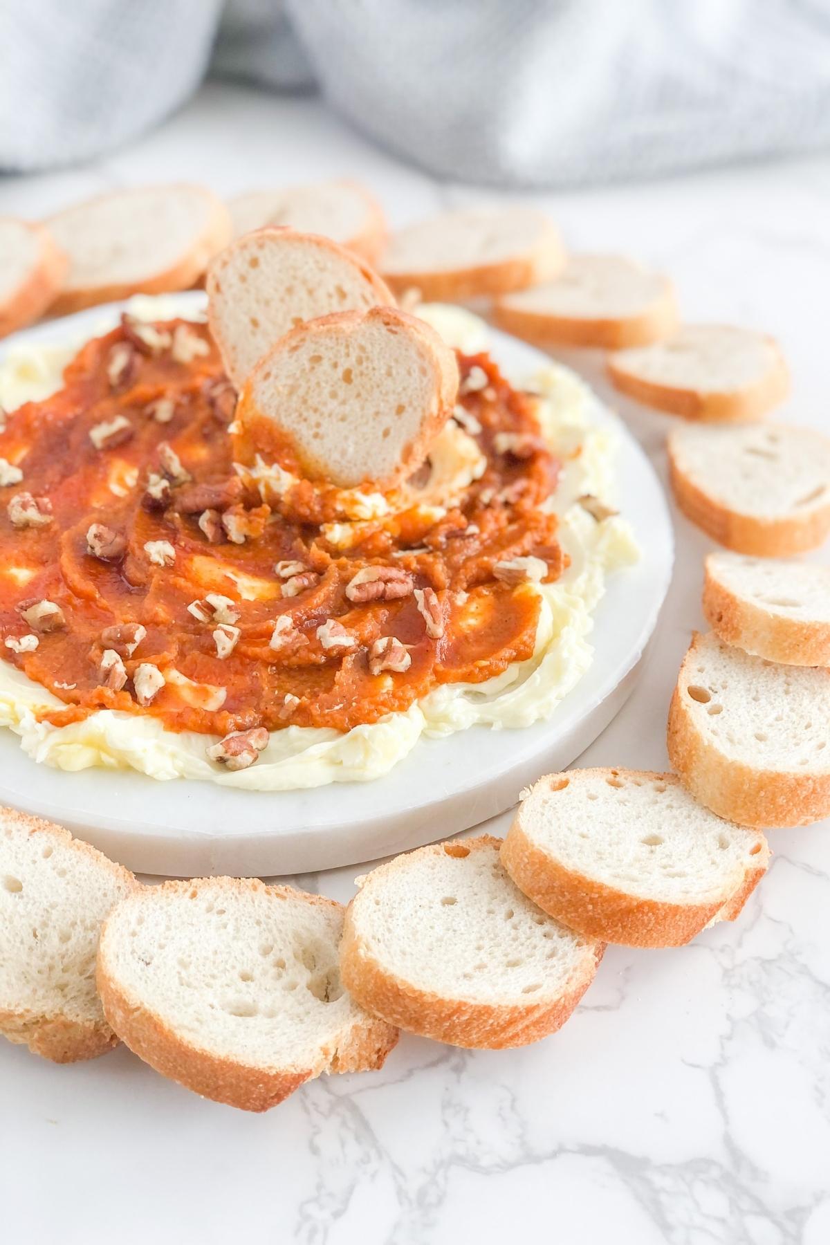 pumpkin honey butter board with pecans and sliced french bread