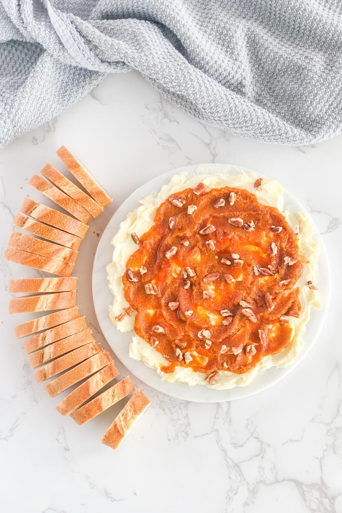 fall butter board on a marble platter with sliced bread