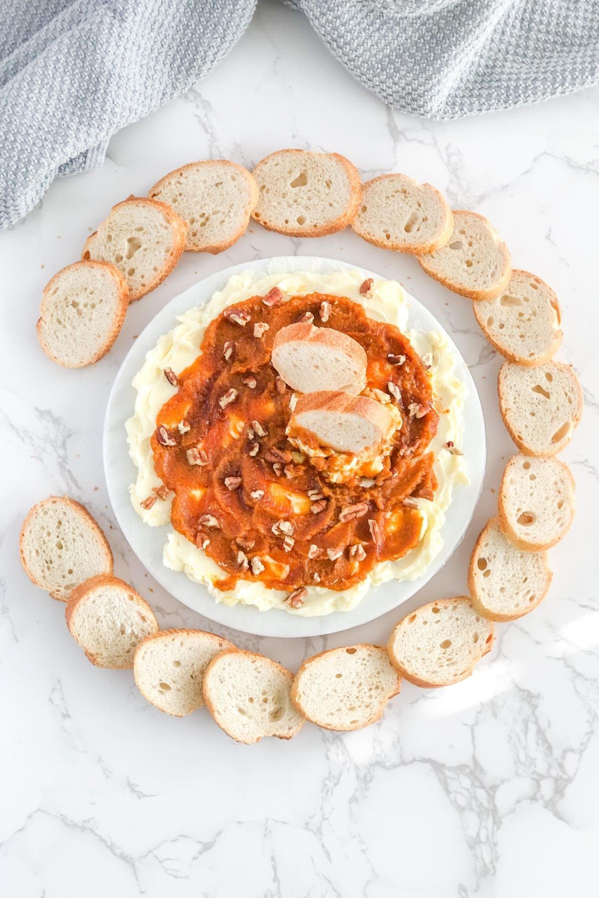 pumpkin butter board with honey and sliced crostini