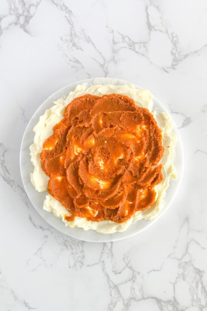 pumpkin puree spread over a butter board