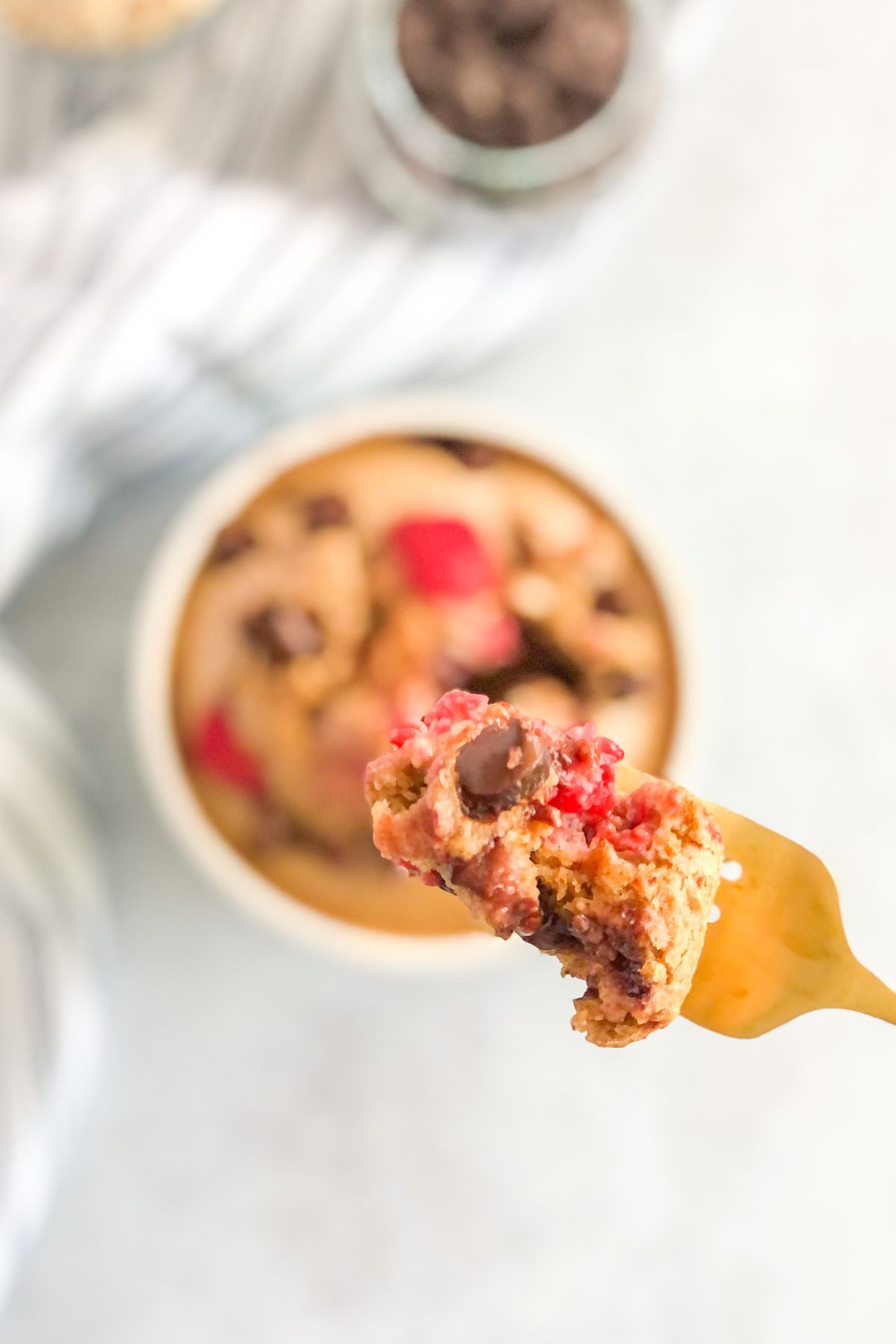 gold fork with raspberry chocolate chip blended oats on it
