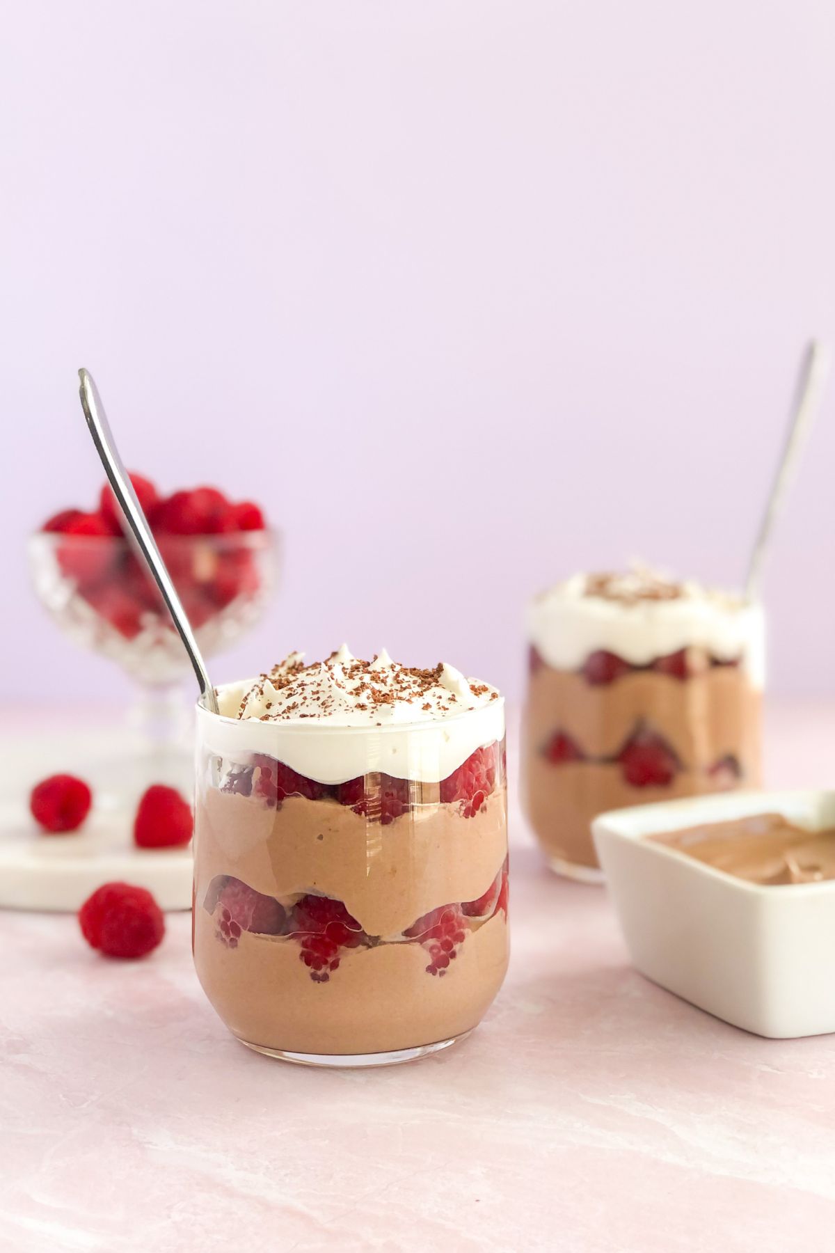 chocolate greek yogurt parfaits in jars with spoons