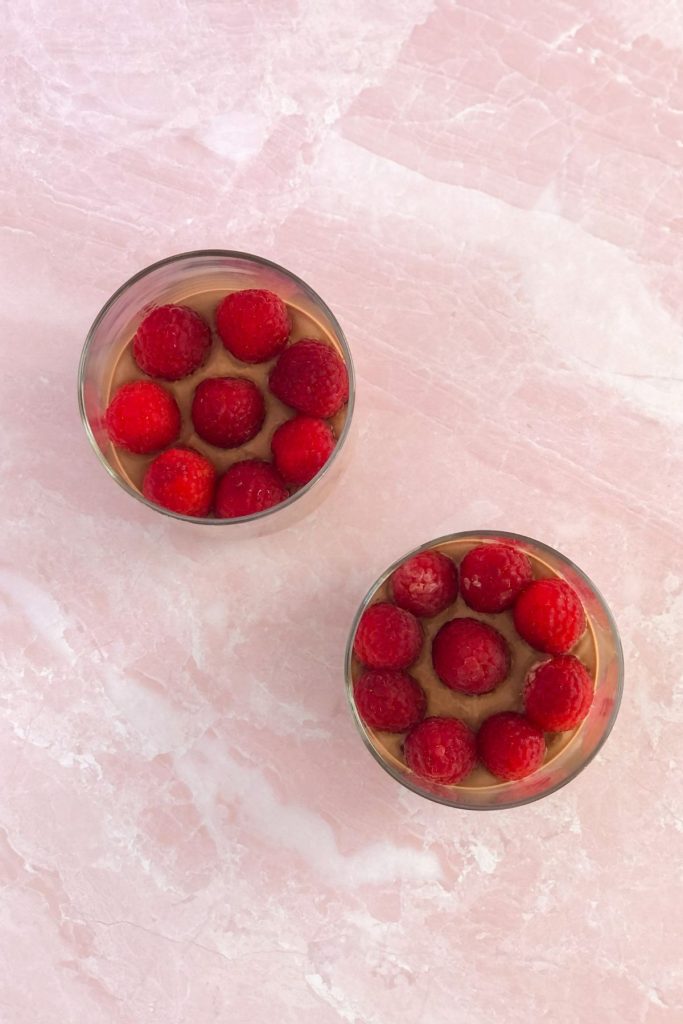 raspberries layered in a parfait
