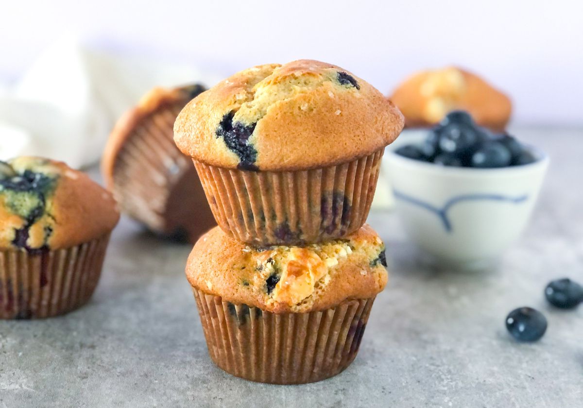 blueberry muffins with white chocolate stacked on top of each other